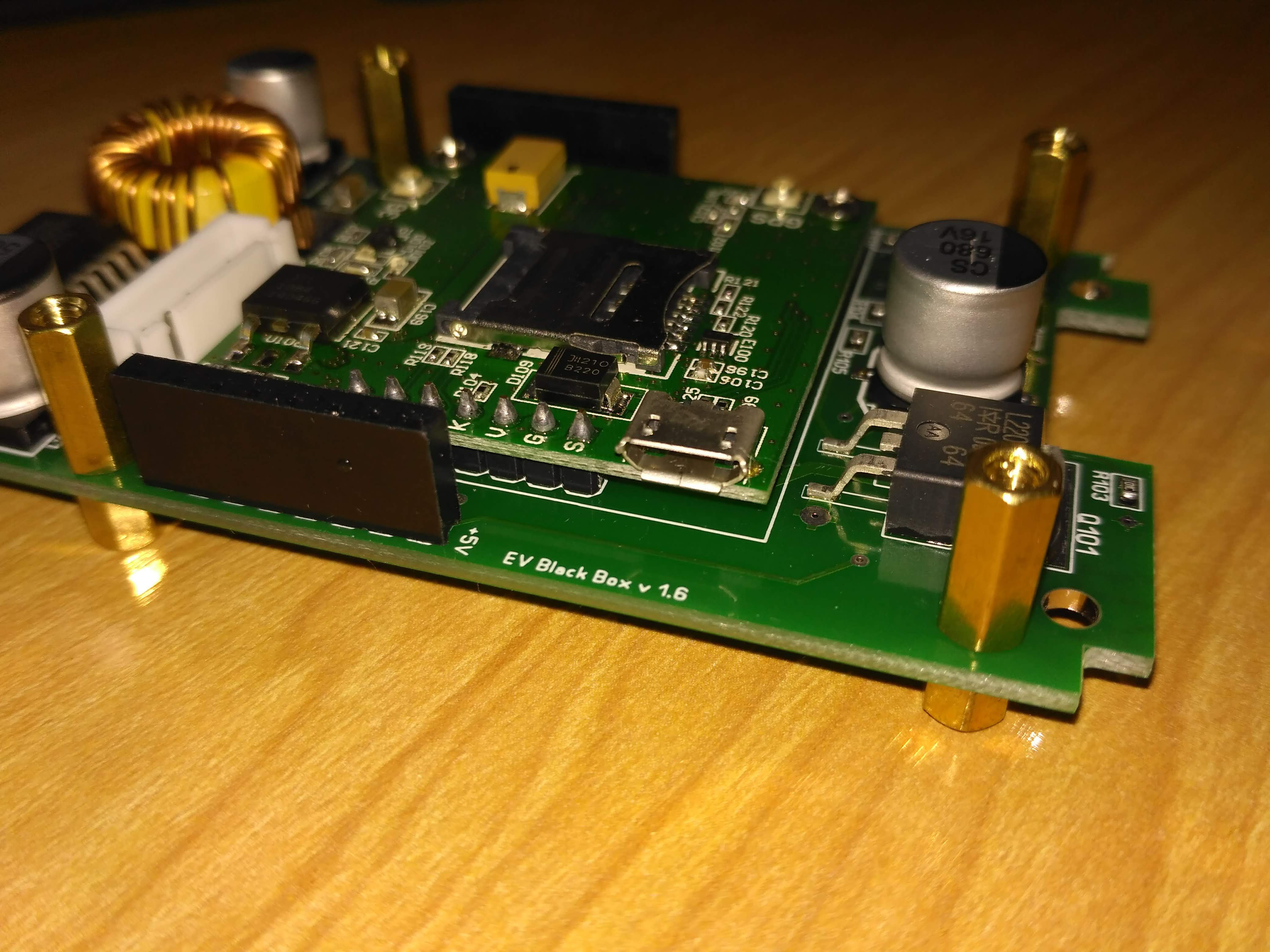EV Black Box v1.6 — custom-designed PCB with SIM card slot, micro-USB, and mounting standoffs
